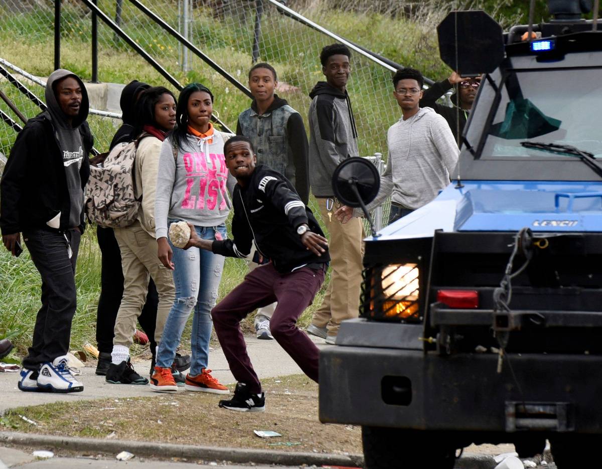 Protesters clash with police near Mondawmin Mall after Freddie Gray's funeral...