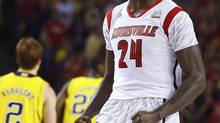 Louisville Cardinals forward Montrezl Harrell celebrates after a dunk against the Michigan Wolverines during the first half of their NCAA men's Final Four championship basketball game in Atlanta, Georgia April 8, 2013. (CHRIS KEANE/REUTERS)