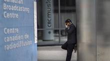 An unidentified man is pictured outside the CBC building in downtown Toronto is seen on Thursday June 26 2014. (Chris Young/THE CANADIAN PRESS)